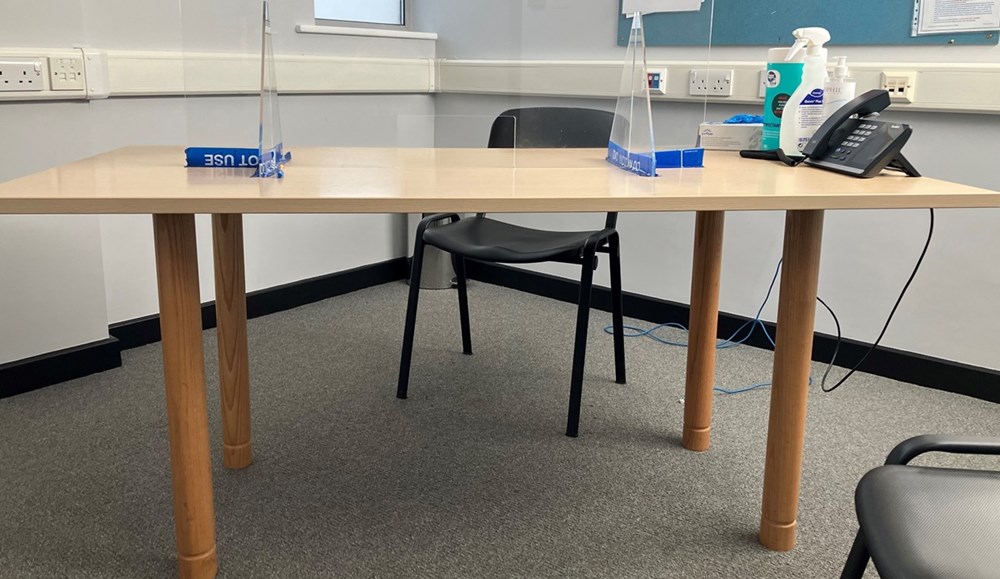 Interview desks with wooden legs.