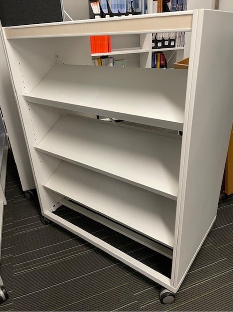 Double sided white metal shelving unit on casters - available on Warp ...