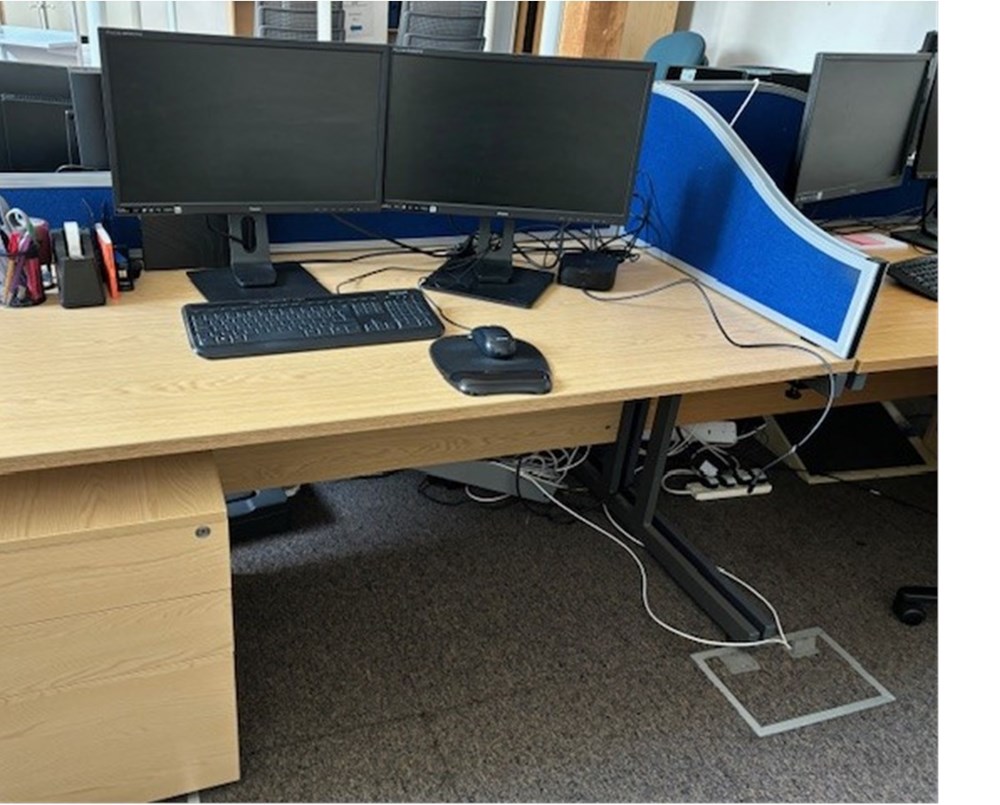 Four wooden desks and under desk drawers