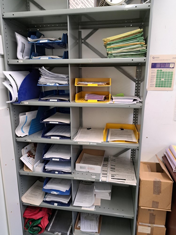 Tall, metal shelving unit