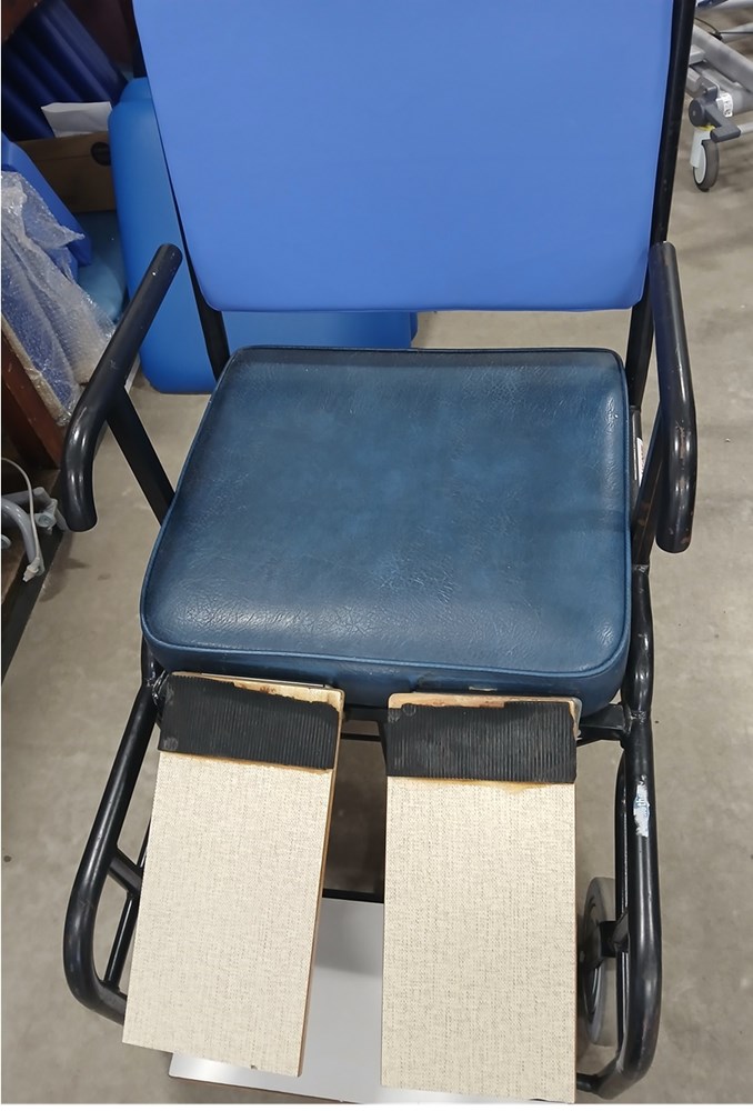 Wheelchair - older style with leg supports