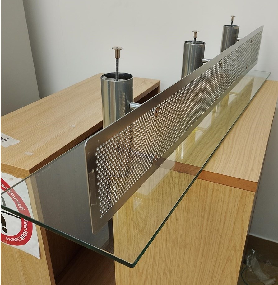 Glass and metal shelf for reception counter