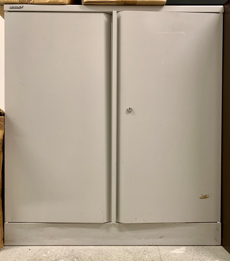 'Bisley' metal storage cupboard with one shelf