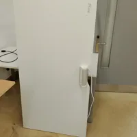 Large white office desk with desk socket.
