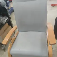 Grey Upholstered Patient Reclining Chair on wheels