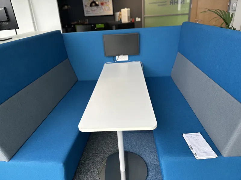 Blue Acoustic Privacy Booth with White Table and Monitor