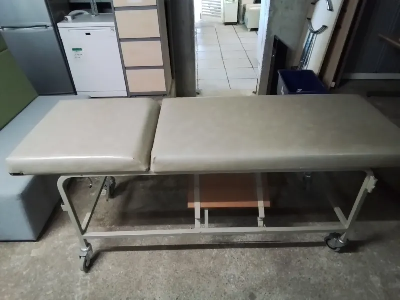 Medical examination couch with headrest and footrest