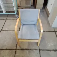 Light blue chair with wooden arms