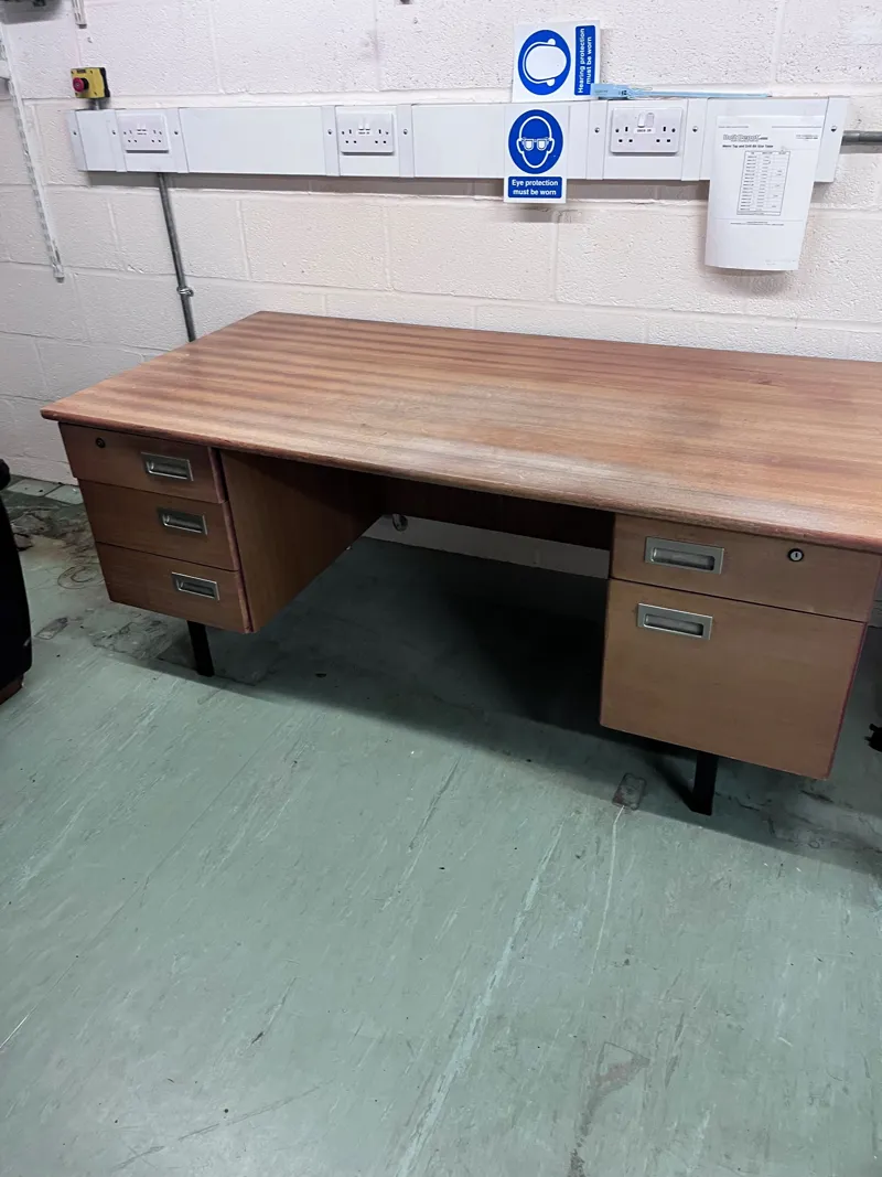 Vintage wooden desk with multiple drawers