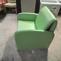 Green Upholstered Armchair with Footrest/Bed Conversion
