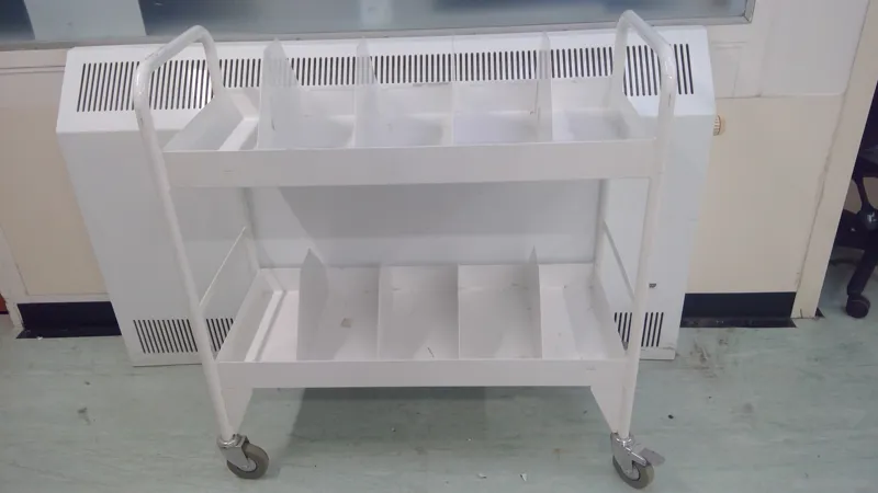 White Medical Trolleys with Multiple Compartments and Wheels