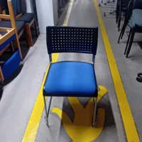 Stacking Chair with Blue Seat and Perforated Back