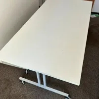 White Folding Table with Metal Frame and Castor Wheels