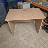 Light oak office desk with cable grommet