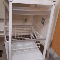 Storage with plastic drawer and wire basket, static, does not have castors/wheels.